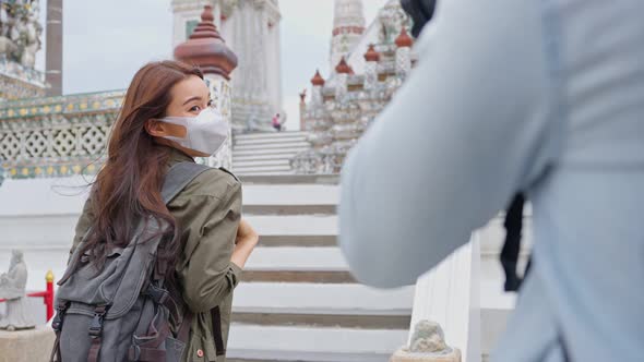 Asian romantic backpacker couple travel in the city for honeymoon trip