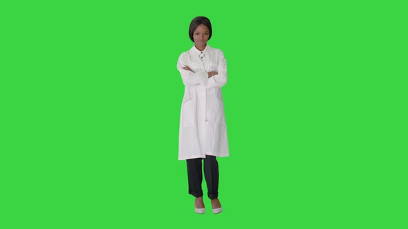 Pretty African American Female Doctor Posing on a Green Screen, Chroma Key.