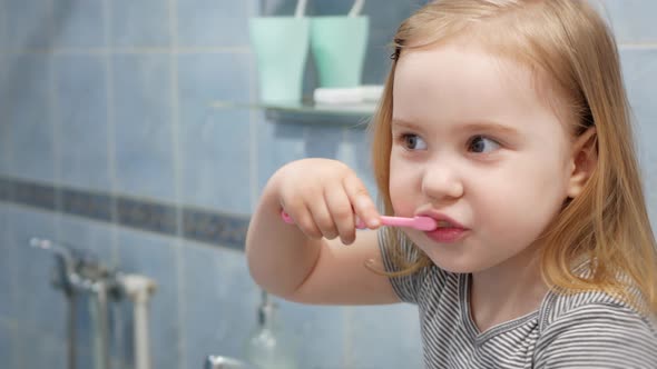 Dad and Daughter Brush Their Teeth in Morning and in Evening Health Care Beautiful Smile White Teeth