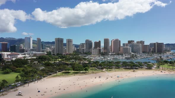 Descending close-up aerial shot of Ala Moana Beach in Honolulu, Hawaii. 4K