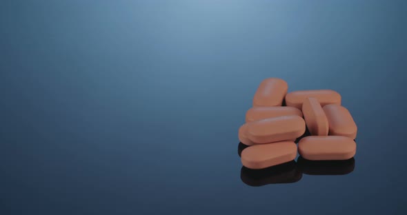 Prescription drugs - Capsules, pills, tablets on reflective background