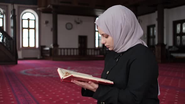 Female Praying On Quran