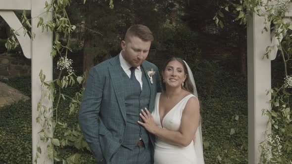 Gorgeous couple posing for photography after their wedding ceremony