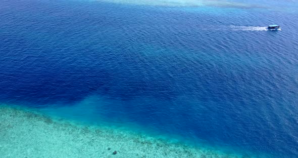 Wide above abstract shot of a white sandy paradise beach and blue ocean background in best quality 4