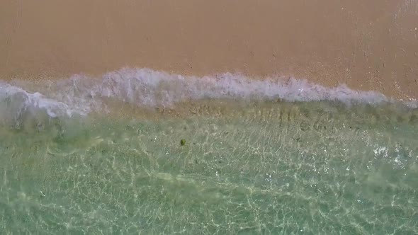 Sunny landscape of tropical bay beach by blue ocean with sand background near sandbar