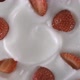 Yogurt decorated with fresh strawberries - Swirl shot - VideoHive Item for Sale