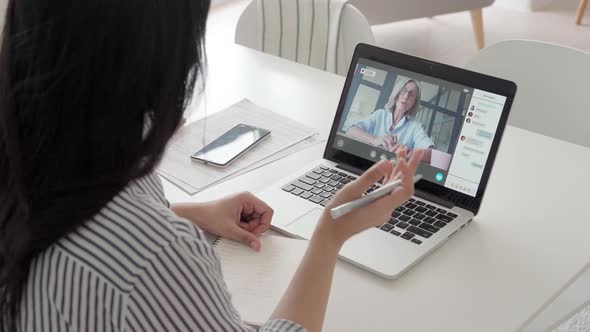 Indian Latin Female Student Having Video Educational Class on Laptop