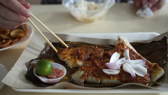 Singaporean, Malaysian food grilled stingray sambal sauce serve on banana leave