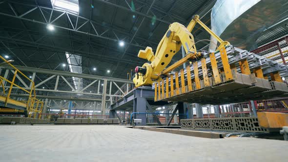 Robotic Mechanism Is Transporting Brick Batches