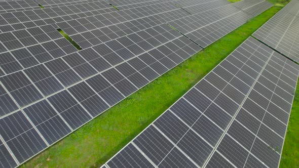 Solar Panels Factory at Sunlight Close-up Aerial View