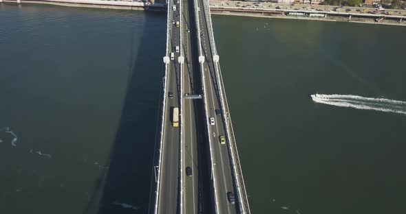 Top Aerial View of The Brooklyn Bridge. Camera Moving Towards Manhattan and Spinning