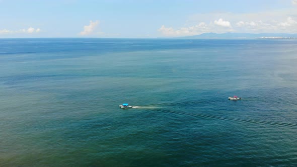 beach sea pacific ocean bay with boat boat sailing on a sunny day