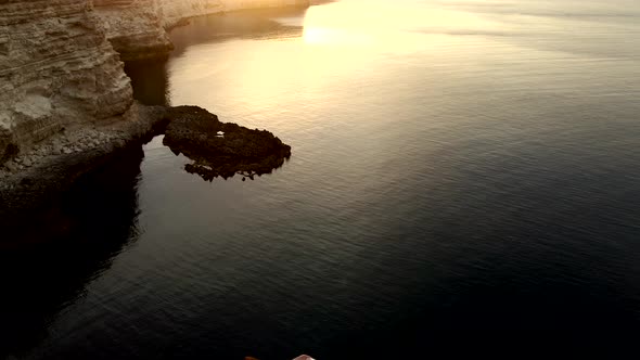 Arch Shape Grotto in Ocean in Ocean Island, Bride After Wedding in Honeymoon