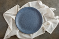 Empty bluish plate on tablecloth above - PhotoDune Item for Sale