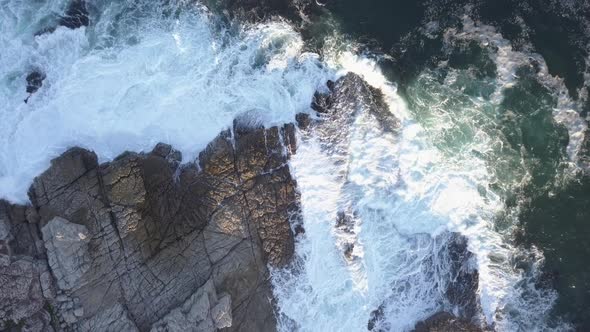 Overhead rocky coastline with waves