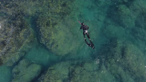 Bird Eye View Shoot of Snorkeling Human in Swimsuit Above Coral Reef