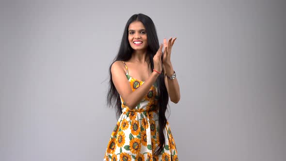 Happy Indian girl clapping