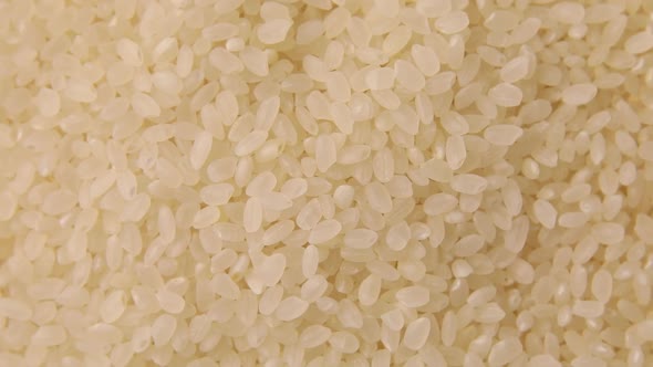 Rotation raw dry white rice groats, cereals