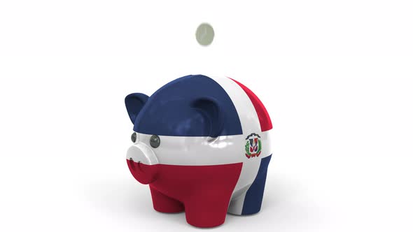 Coins Fall Into Piggy Bank Painted with Flag of the Dominican Republic