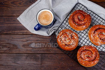 nelbulle with cup of coffee or cappuccino, on a wooden background, horizontal, copy space, top view