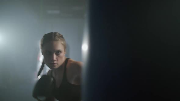 Female Fighter Trains His Punches Beats a Punching Bag Training Day in the Boxing Gym Strength Fit