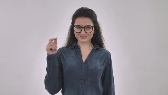 Female Smiling Holding Spectacles