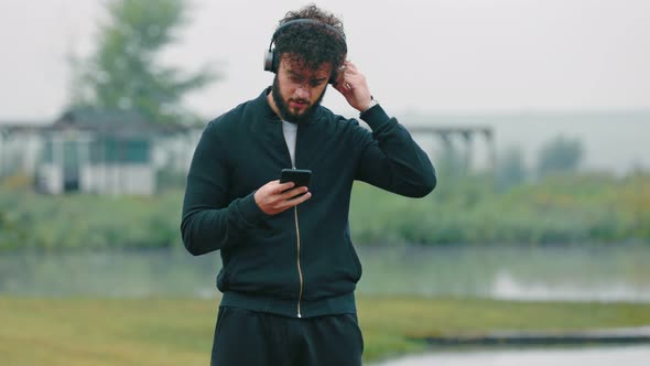 Man Listening to Music with Headphones
