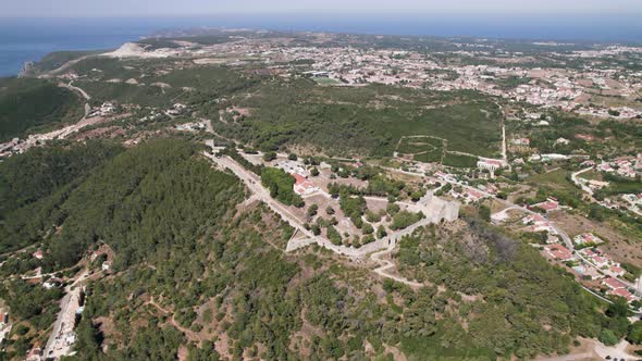 Aerial panoramic view of Sesimbra Castle and surrounding landscape, Portugal.