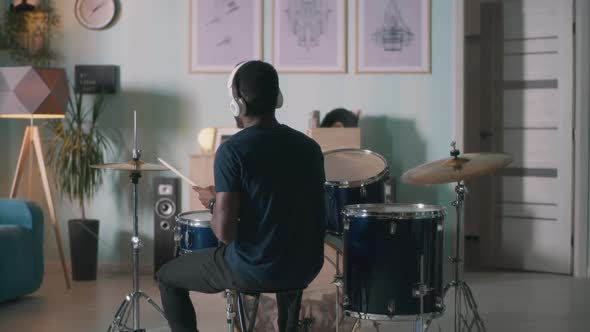 Black Drummer Rehearsing at Home