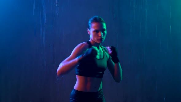 Wet Woman Doing Hit Boxing Workout
