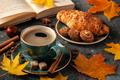 Autumn background with cup of black coffee, croissant and fall decoration - PhotoDune Item for Sale