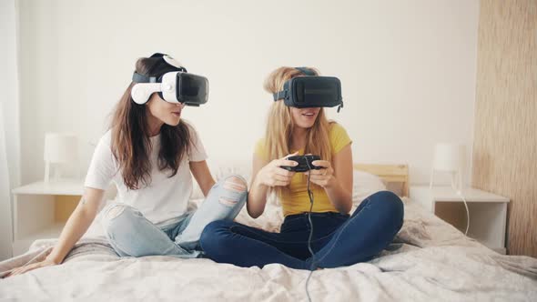 Exited Girls in VR Helmets at Home