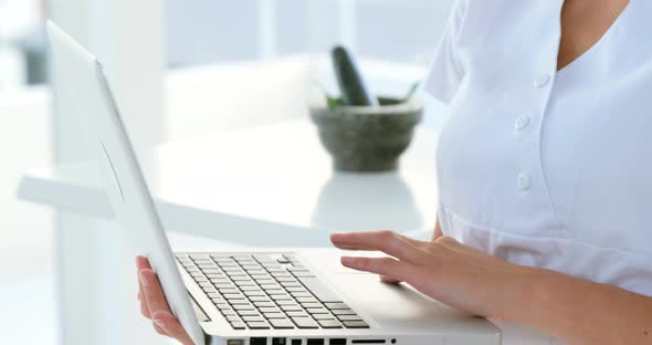 Portrait of therapist using her laptop