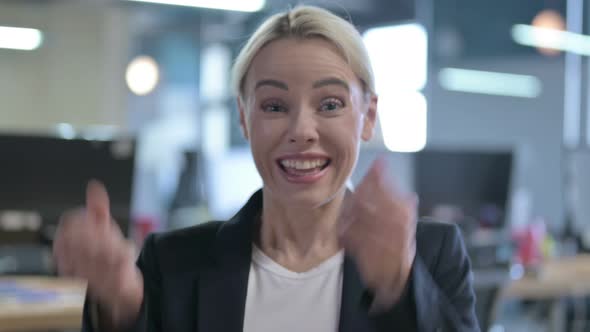 Portrait of Surprised Businesswoman Celebrating Success