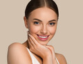 Beautiful skin face woman natural make up healthy skin touching her face. Color background. Brown - PhotoDune Item for Sale