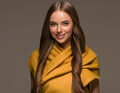 Woman in knit clothes yellow autumn winter style long hair. Color background brown - PhotoDune Item for Sale