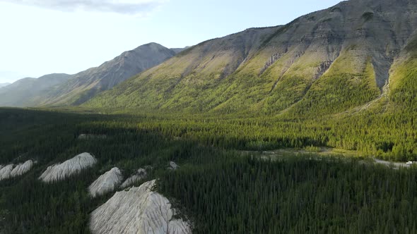 Drone flying over the valley of Mineral Lick area in Northern Rocky Mountains, British Columbia, Can