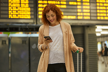 g and chatting on mobile phone at station