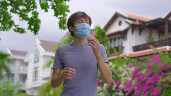 Quarantine Is Over Concept. Man Takes Off Medical Mask on a Street. We Are Safe. Coronavirus Ended