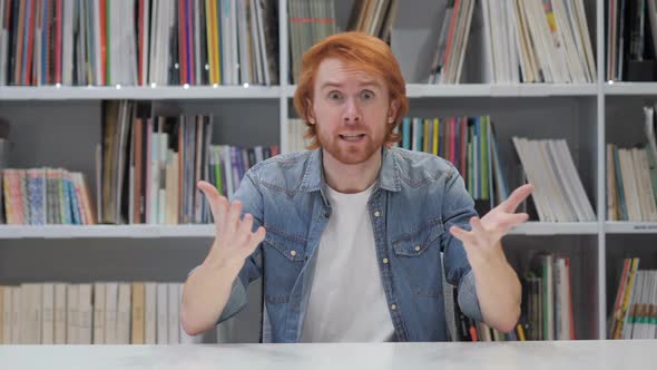 Angry Fighting Redhead Man at Work in Office