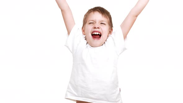 Elementaryschool Aged Caucasian Boy Stretching and Yawning Stadning on White Background