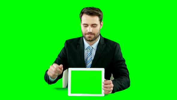 Businessman with digital tablet touching digital screen