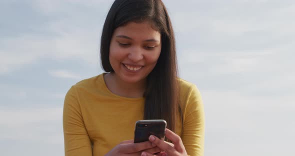 Young woman using her phone