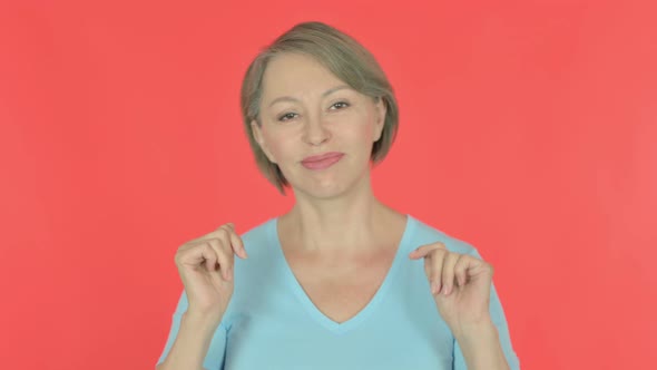 Old Woman Dancing in Joy on Red Background