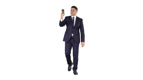 Young businessman using smartphone to videocall to business