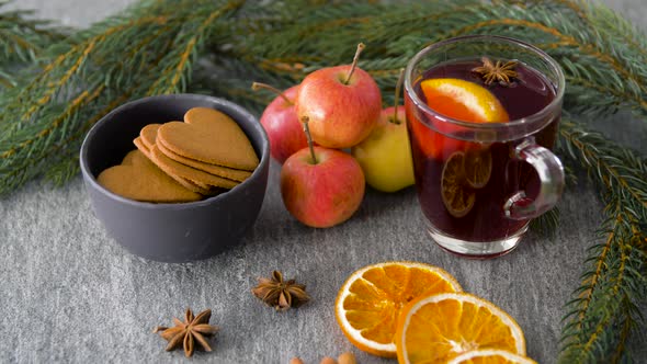 Glass of Hot Mulled Wine, Cookies, Apples and Fir