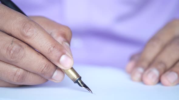 Close Up of Man Hand Writing a Letter with Fountain Pen