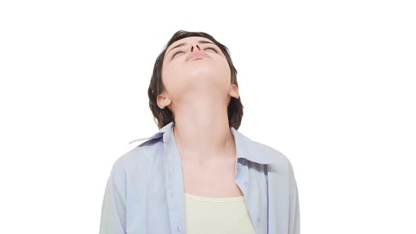 Young Tired Caucasian Female with Beautiful Short Hair Sighing Heavily Over White Background in