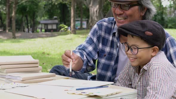 Senior man and boy learning together