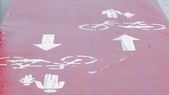 Pedestrian Redcolored Walkway for Cyclists Sign on a Rainy Day